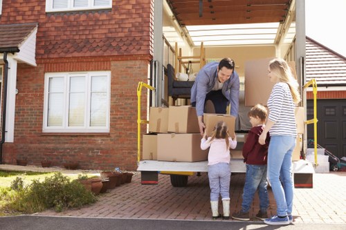 Removal van and moving team planning a house move in Stockwell