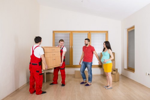 Removal van and moving crew in a South London residential street