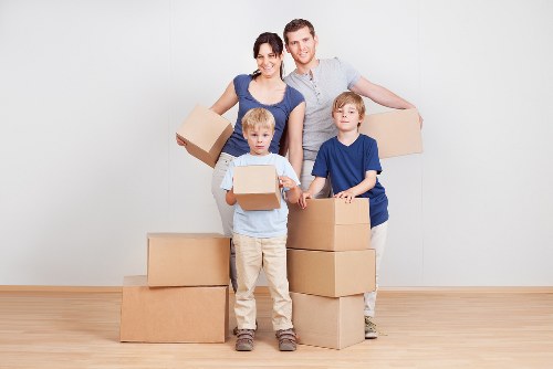 Professional movers loading household items in Stockwell