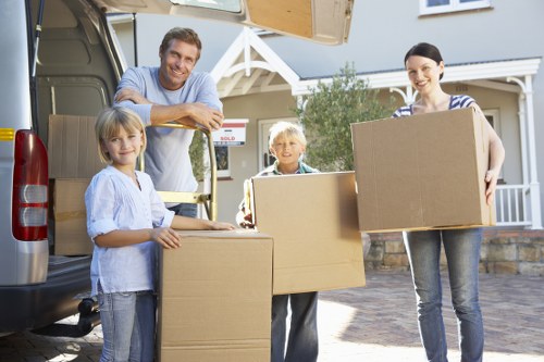 Team handling furniture and transport items during a move